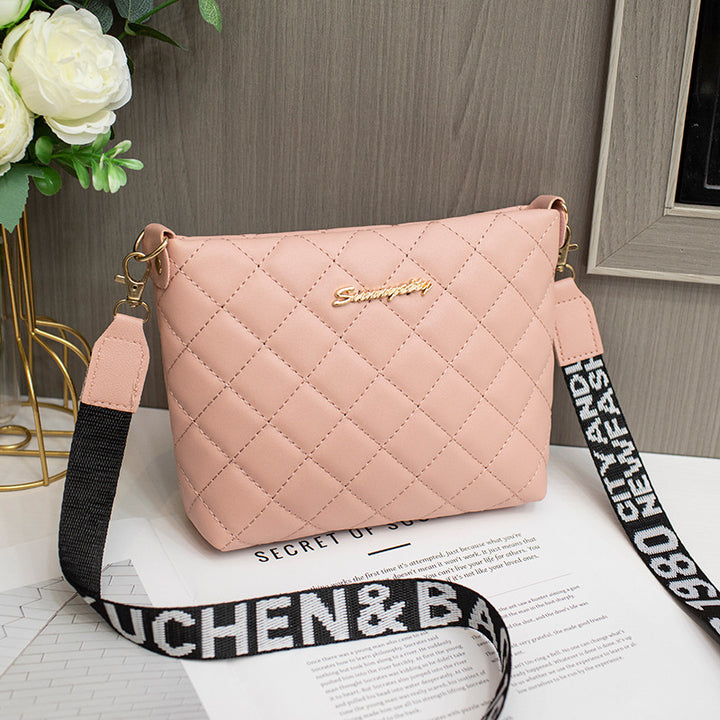Black quilted crossbody bag with wide strap