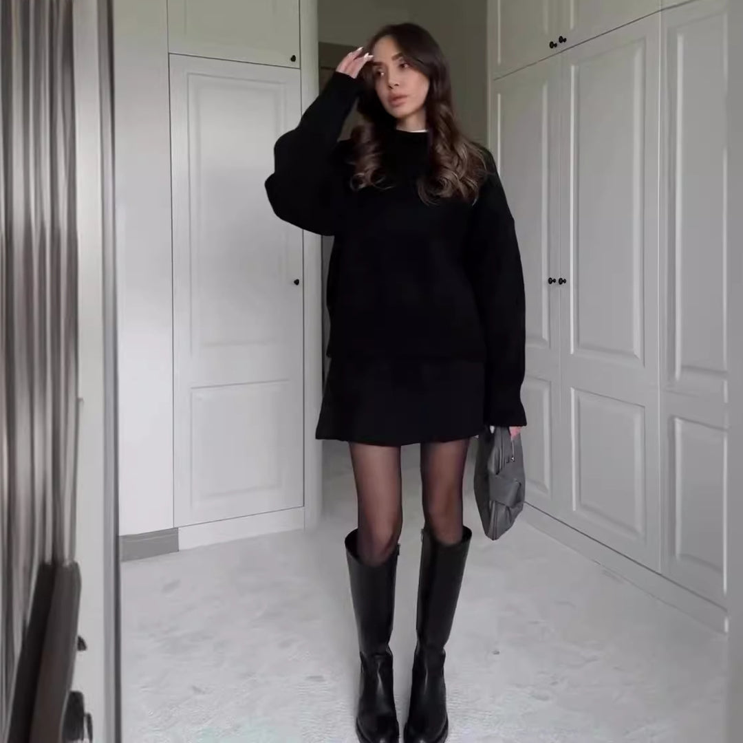 Woman in matching knit sweater and mini skirt set