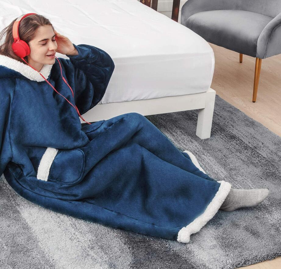 Oversized sherpa hoodie blanket on the couch