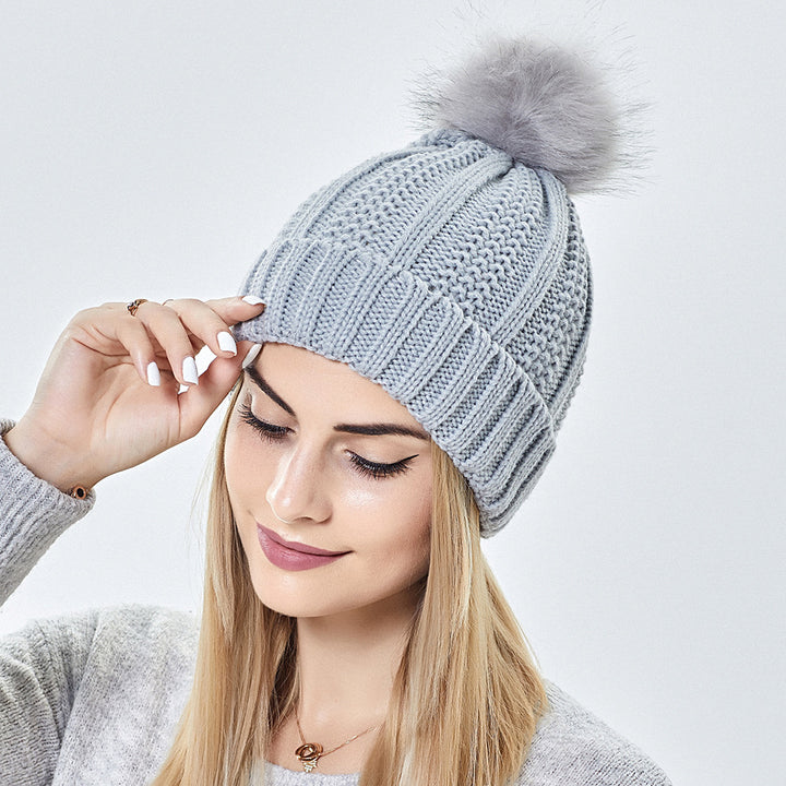 Knit beanie with faux fur pom pom