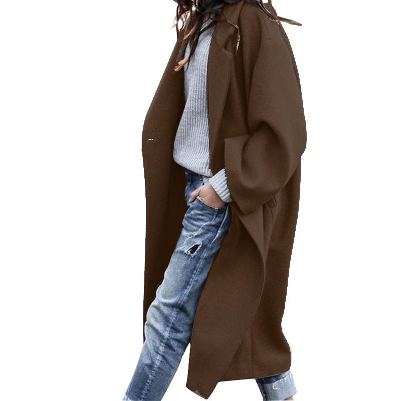 Woman in long oversized lapel coat