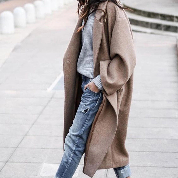 Woman in long oversized lapel coat