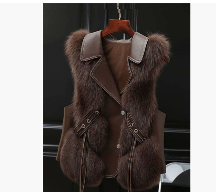 Woman in a short faux fur vest