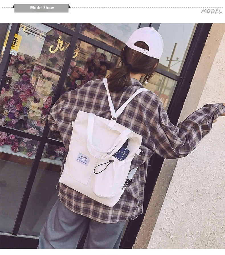 Canvas tote bag worn as a backpack